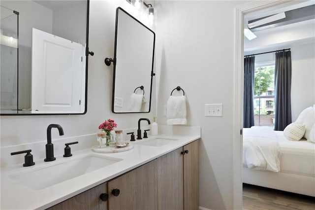 126 Chestnut Cir, Atlanta, GA 30342 - ensuite bathroom featuring double vanity and wood finished floors