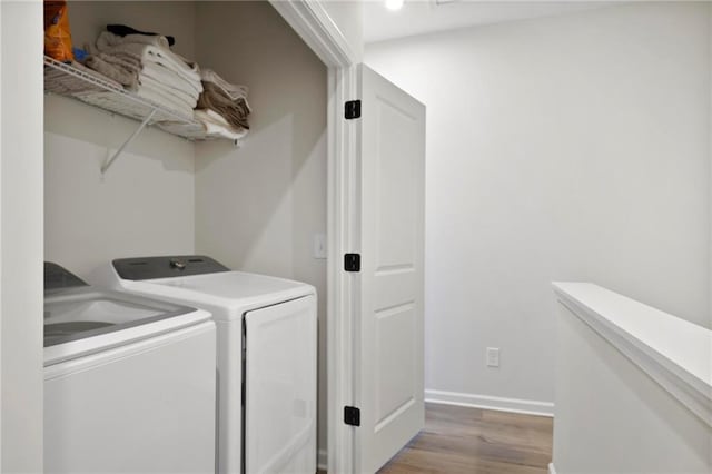126 Chestnut Cir, Atlanta, GA 30342 - laundry area featuring washer and dryer, wood finished floors, and baseboards