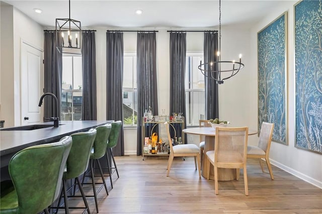 126 Chestnut Cir, Atlanta, GA 30342 - dining room with a chandelier, light wood finished floors, baseboards, and recessed lighting