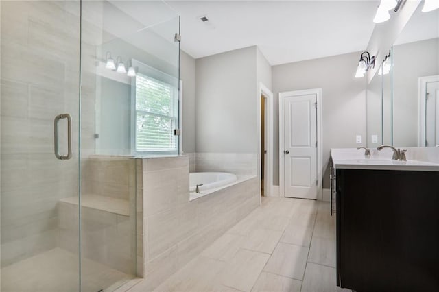 4884 Kentwood Dr, Marietta, GA 30068 - full bath featuring vanity, a garden tub, and a stall shower