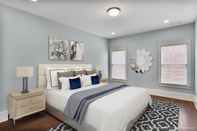 4884 Kentwood Dr, Marietta, GA 30068 - bedroom featuring baseboards, dark wood-style floors, multiple windows, and visible vents