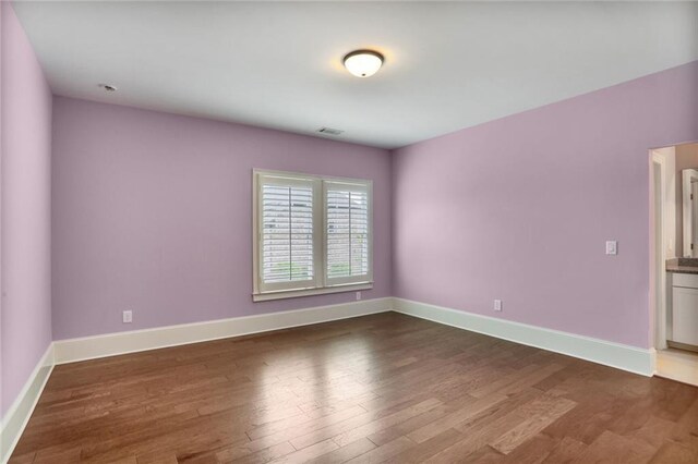 4884 Kentwood Dr, Marietta, GA 30068 - spare room featuring baseboards, dark wood-style flooring, and visible vents