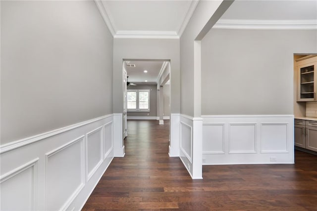 4884 Kentwood Dr, Marietta, GA 30068 - hallway with dark wood-style flooring, a decorative wall, a wainscoted wall, visible vents, and ornamental molding