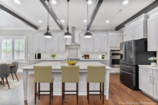 4884 Kentwood Dr, Marietta, GA 30068 - kitchen with wall chimney range hood, crown molding, appliances with stainless steel finishes, and tasteful backsplash