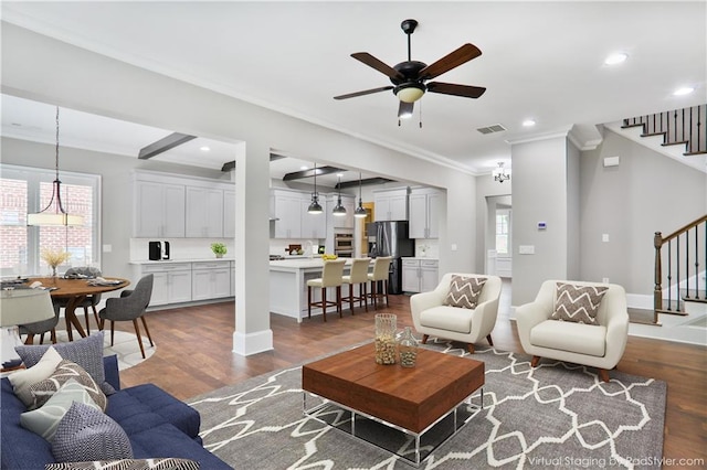 4884 Kentwood Dr, Marietta, GA 30068 - living room with visible vents, stairs, crown molding, and dark wood-style floors