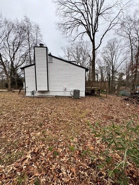 view of property exterior with central AC unit