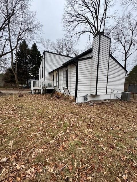 view of property exterior featuring central AC unit