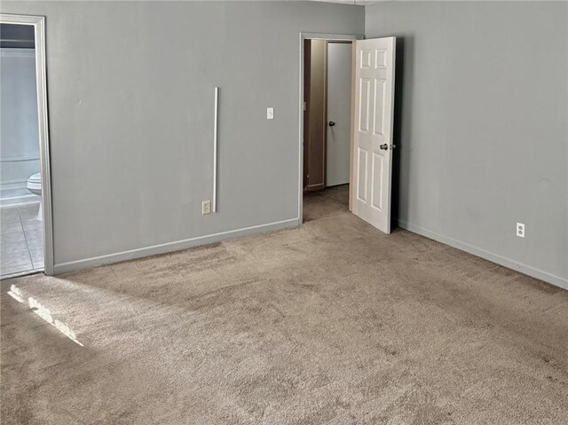 full bathroom with tile patterned flooring, vanity, tiled shower / bath, and toilet