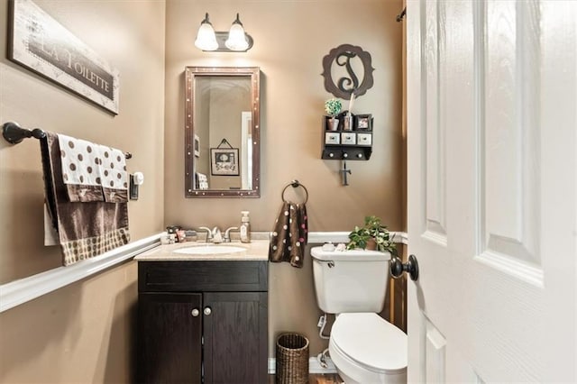 242 Sandhurst Ct, Suwanee, GA 30024 - half bathroom featuring toilet and vanity