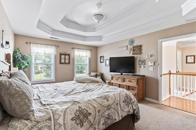 242 Sandhurst Ct, Suwanee, GA 30024 - bedroom featuring crown molding, light colored carpet, and a raised ceiling