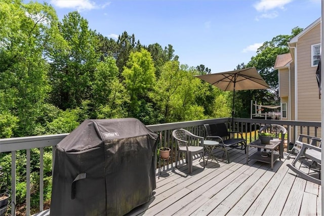 242 Sandhurst Ct, Suwanee, GA 30024 - wooden terrace featuring a grill