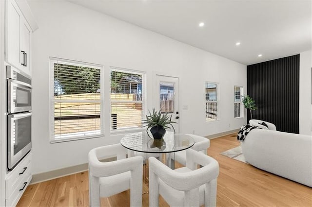 dining space featuring light hardwood / wood-style floors