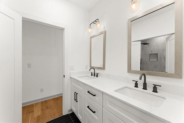 bathroom with hardwood / wood-style floors and vanity