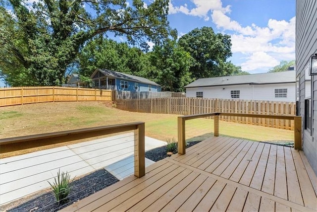 wooden terrace with a yard