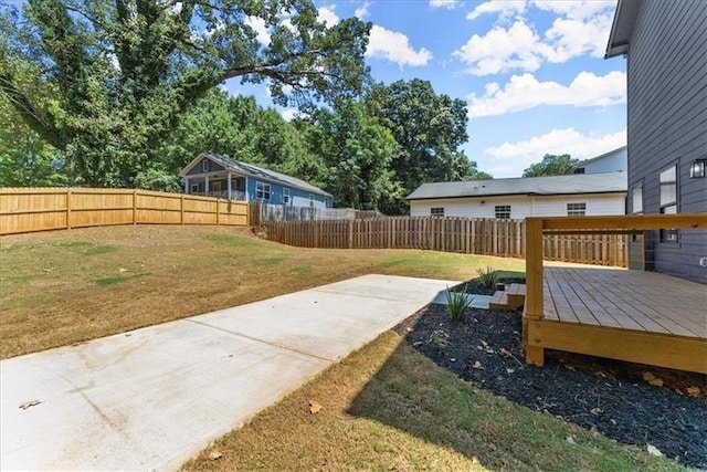 view of yard with a wooden deck