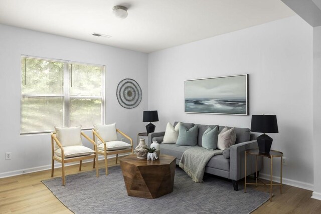 living room featuring wood finished floors and baseboards
