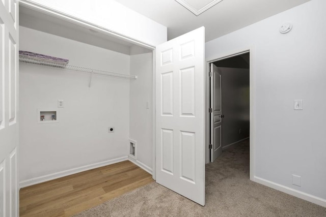 washroom with light carpet, washer hookup, hookup for an electric dryer, and baseboards