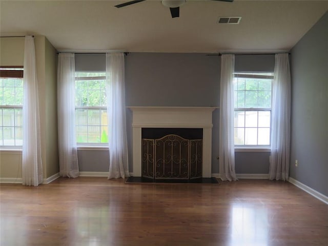 4517 Baker Grove Rd NW, Acworth, GA 30101 - unfurnished living room featuring a ceiling fan, wood finished floors, baseboards, and a fireplace