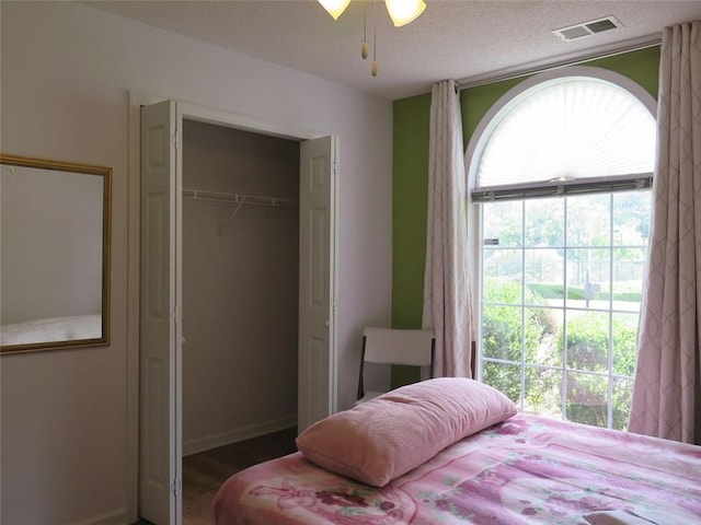 4517 Baker Grove Rd NW, Acworth, GA 30101 - bedroom featuring a closet, wood finished floors, and a textured ceiling