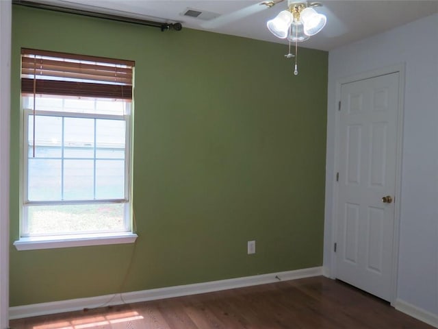 4517 Baker Grove Rd NW, Acworth, GA 30101 - empty room featuring plenty of natural light, a ceiling fan, wood finished floors, and baseboards