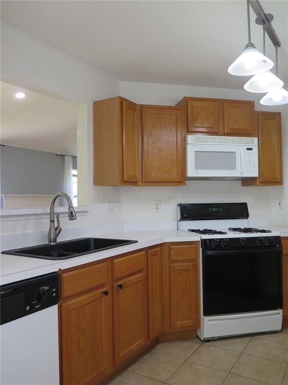 4517 Baker Grove Rd NW, Acworth, GA 30101 - kitchen featuring white appliances, a sink, light countertops, and light tile patterned flooring