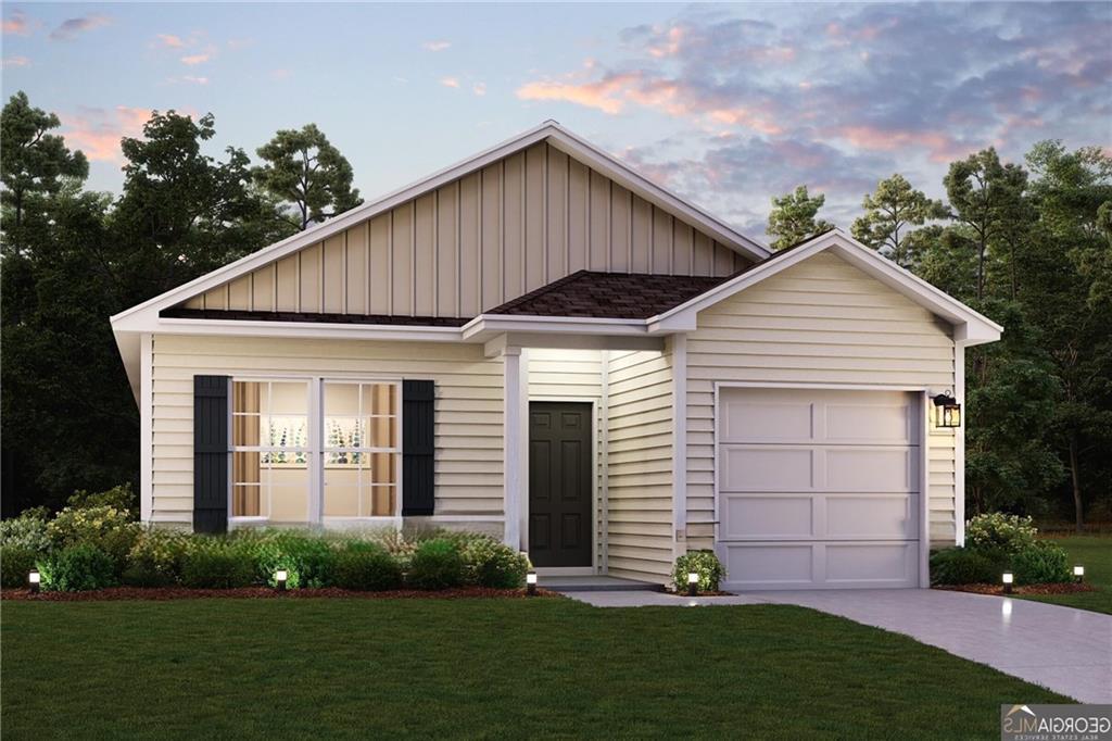 226 Central St, Cedartown, GA 30125 - view of front of property with board and batten siding, a lawn, a garage, and driveway