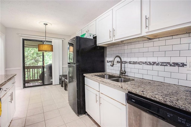 8740 Roswell Rd Unit 2G, Atlanta, GA 30350 - kitchen with dishwasher, a sink, freestanding refrigerator, decorative backsplash, and white cabinetry