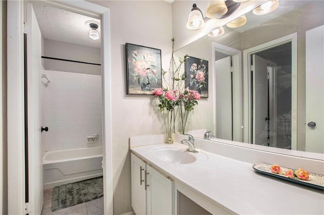 8740 Roswell Rd Unit 2G, Atlanta, GA 30350 - bathroom featuring vanity, tile patterned floors, shower / washtub combination, and baseboards