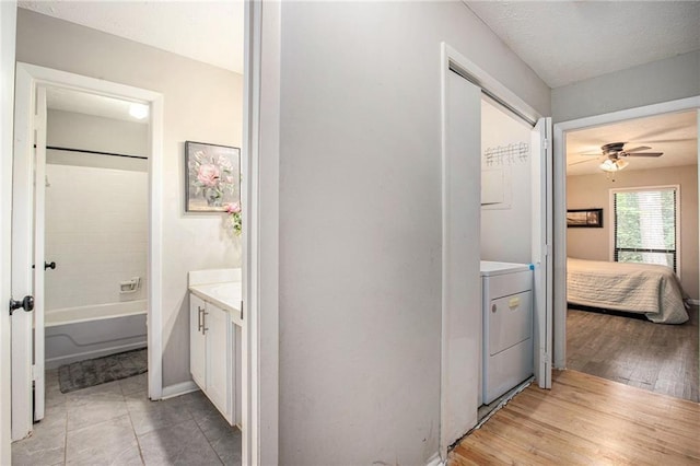 8740 Roswell Rd Unit 2G, Atlanta, GA 30350 - bathroom with vanity, washer / dryer, a ceiling fan, ensuite bath, and shower / bathtub combination
