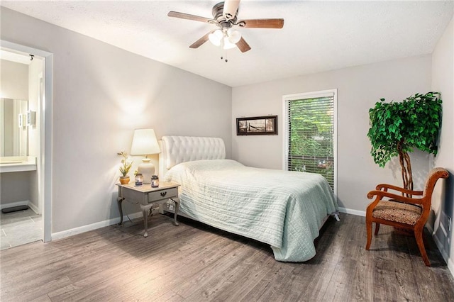 8740 Roswell Rd Unit 2G, Atlanta, GA 30350 - bedroom featuring wood finished floors, baseboards, ensuite bathroom, and a ceiling fan
