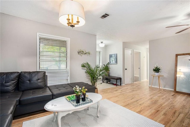 8740 Roswell Rd Unit 2G, Atlanta, GA 30350 - living room featuring light wood finished floors and ceiling fan