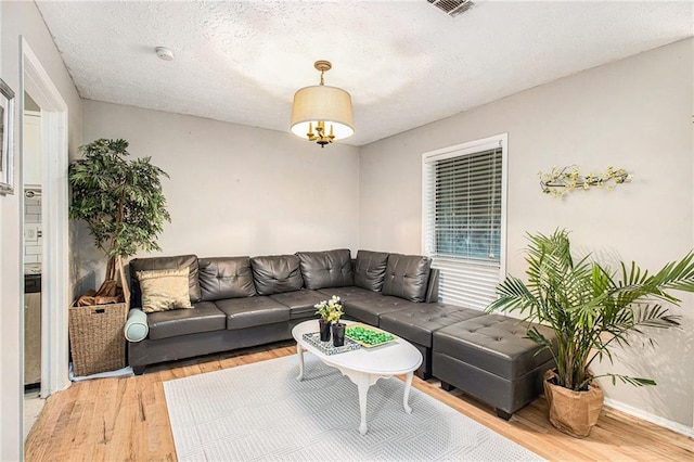 8740 Roswell Rd Unit 2G, Atlanta, GA 30350 - living room featuring light wood-style flooring and baseboards
