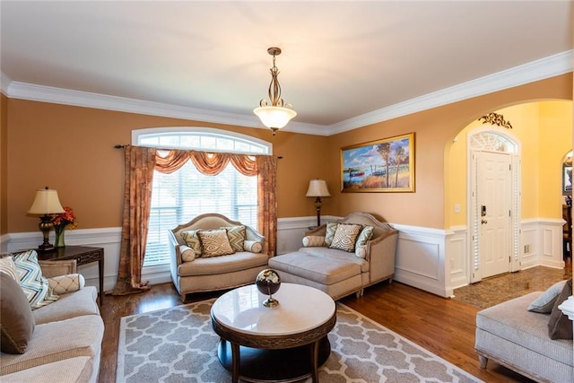 living room featuring hardwood / wood-style flooring and ornamental molding