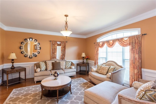 living room with ornamental molding and hardwood / wood-style floors