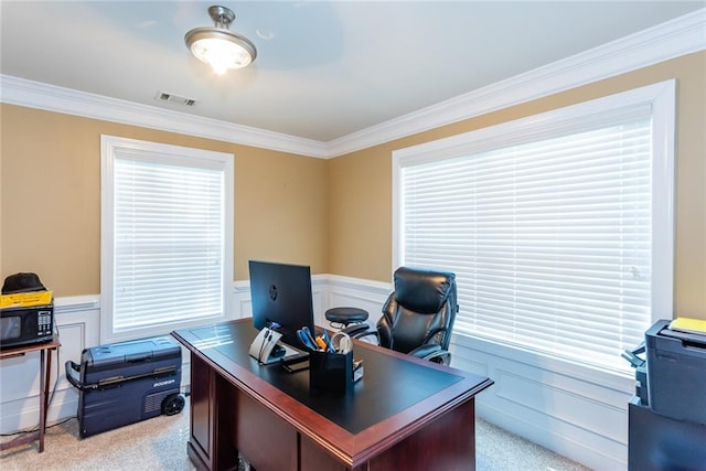 carpeted office space featuring ornamental molding