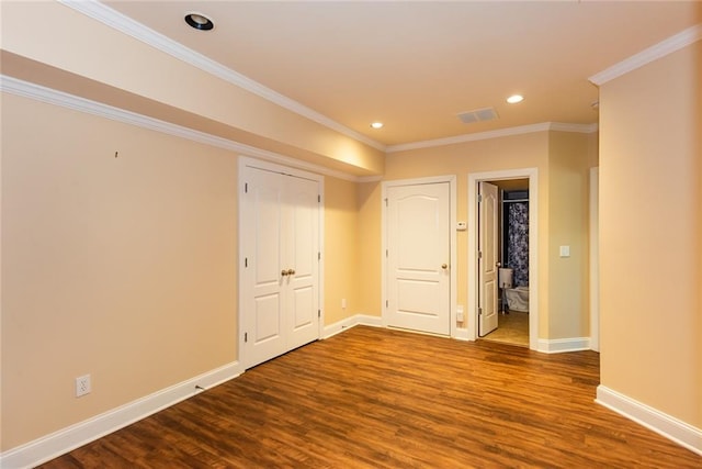 interior space featuring ornamental molding and hardwood / wood-style floors