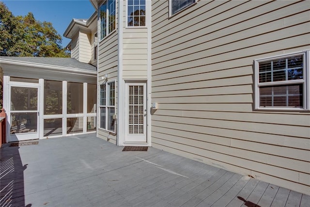 wooden terrace featuring a sunroom