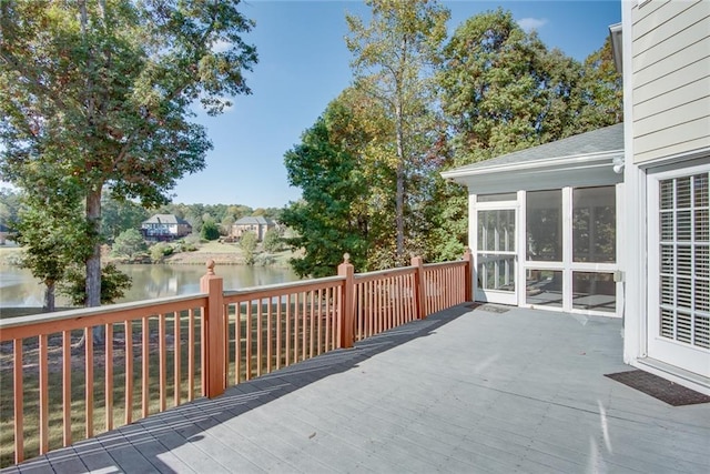 wooden deck with a water view