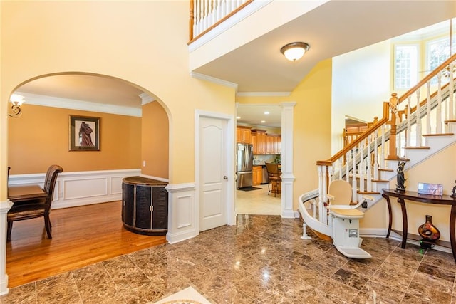 entryway with crown molding and hardwood / wood-style flooring