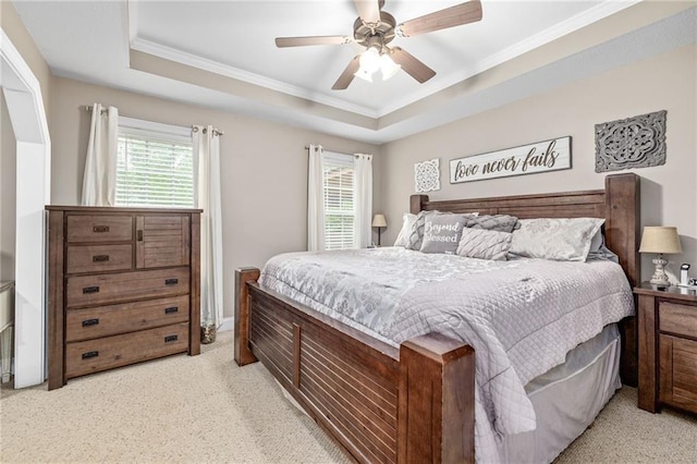 253 Grindstone Creek Dr, Clarkesville, GA 30523 - bedroom featuring crown molding, light carpet, a tray ceiling, and a ceiling fan