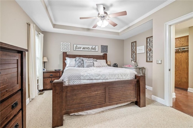 253 Grindstone Creek Dr, Clarkesville, GA 30523 - bedroom featuring a raised ceiling, light colored carpet, crown molding, ceiling fan, and baseboards