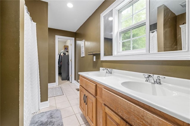 253 Grindstone Creek Dr, Clarkesville, GA 30523 - bathroom with double vanity, tile patterned floors, baseboards, a spacious closet, and curtained shower