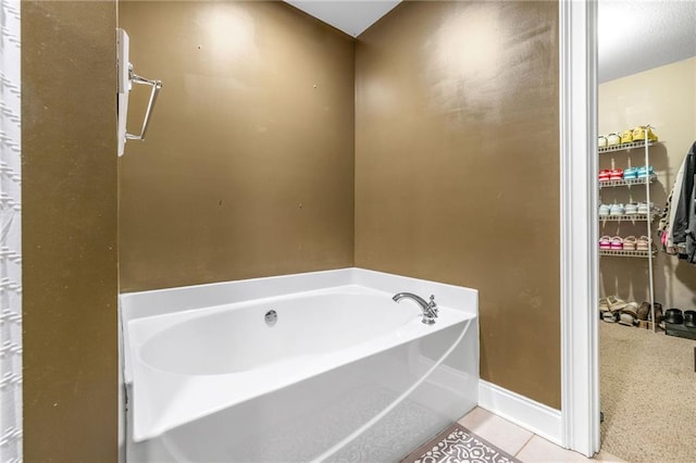 253 Grindstone Creek Dr, Clarkesville, GA 30523 - full bath with a garden tub, baseboards, and tile patterned flooring