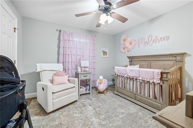 253 Grindstone Creek Dr, Clarkesville, GA 30523 - bedroom featuring a crib, baseboards, ceiling fan, and carpet