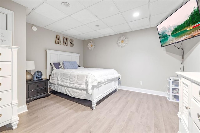 253 Grindstone Creek Dr, Clarkesville, GA 30523 - bedroom featuring light wood-style floors, a paneled ceiling, and baseboards