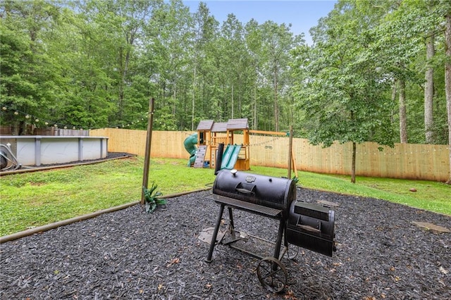 253 Grindstone Creek Dr, Clarkesville, GA 30523 - view of patio featuring a playground and a grill