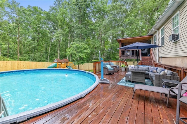 253 Grindstone Creek Dr, Clarkesville, GA 30523 - view of swimming pool with an outdoor hangout area, a deck, a fenced backyard, a playground, and cooling unit