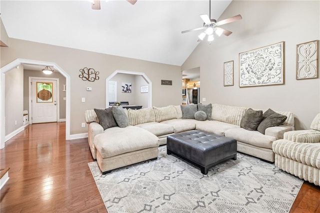 253 Grindstone Creek Dr, Clarkesville, GA 30523 - living area with ceiling fan, arched walkways, wood finished floors, baseboards, and high vaulted ceiling