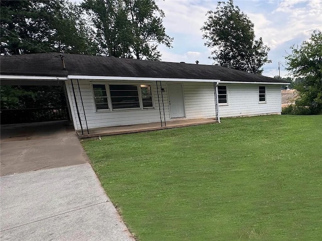 ranch-style home with a front lawn and a carport