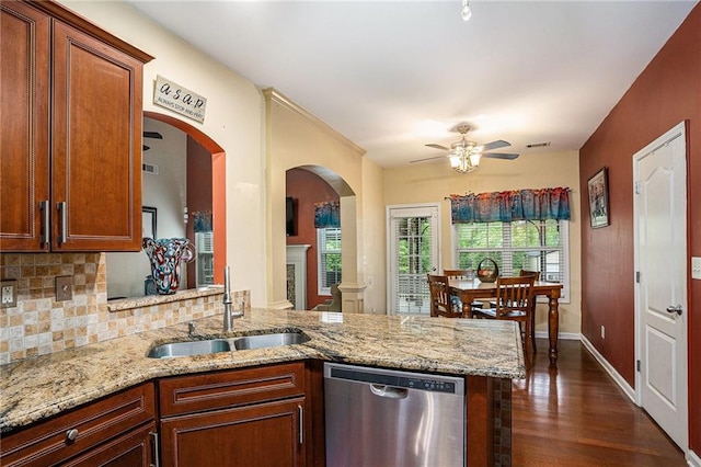 kitchen with decorative backsplash, ceiling fan, a sink, dark wood finished floors, and dishwasher